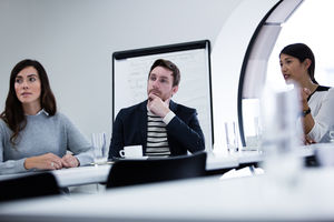 Colleagues listening in a business meeting