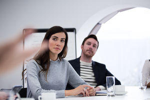Colleagues listening in a business meeting