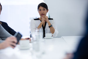 Female director listening in a business meeting