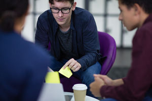 Student with sticky notes at college