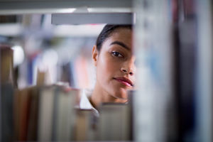 Student looking for a book in library