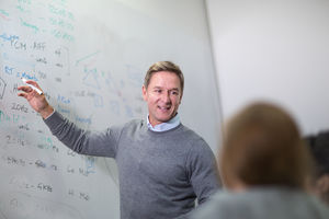 Teacher giving a class at college