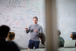 Teacher giving a class at college