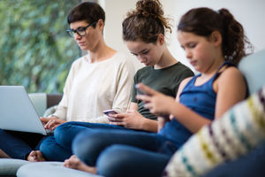 Family all using personal technology