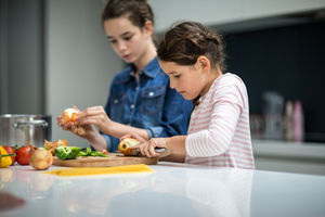 Sisters cooking a meal together