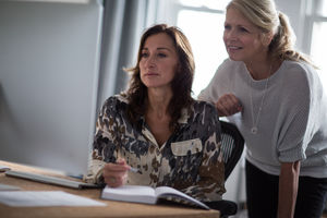 Mature businesswomen working together