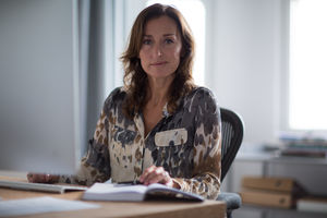 Portrait of mature businesswoman at desk