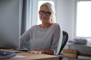 Portrait of mature businesswoman at desk