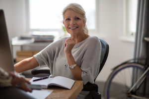 Mature businesswoman working on computer