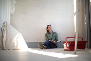 Mature female choosing paint colors