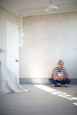 Mature female choosing paint colors