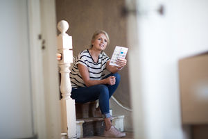 Mature female choosing paint colors