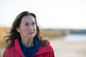 Mature female enjoying the outdoors in winter on the beach
