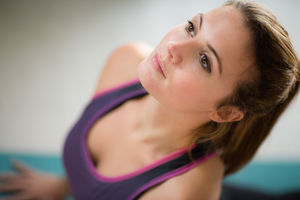 Young adult female practicing yoga