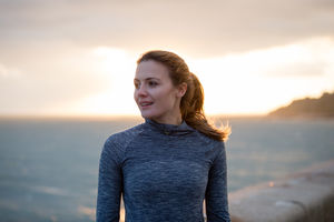 Young adult female exercising outdoors