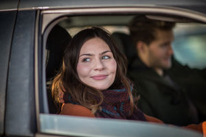 Young adult female driving car
