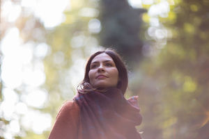 Young adult female enjoying the outdoors in autumn
