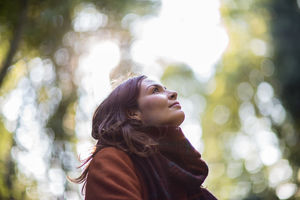 Young adult female enjoying the outdoors in autumn