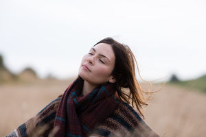 Young adult female enjoying the outdoors in autumn