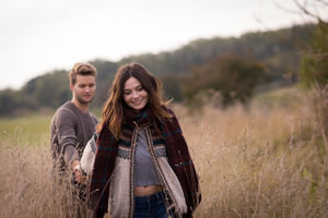 Couple walking in field of corn