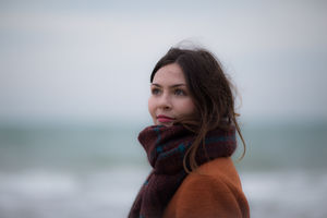 Young adult female on winter beach