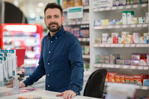 Portrait of pharmacist in store