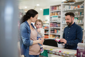 Mother with daughter at pharmacy