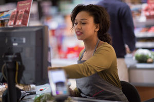 Sales clerk working at grocery store