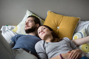 Young couple relaxing in bed