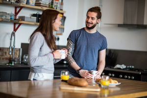 Young couple enjoying breakfast together