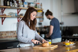Young couple preparing breakfast together