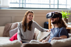 Young adult male using VR headset