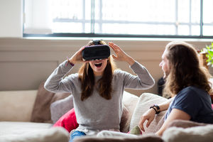 Young adult female using VR headset