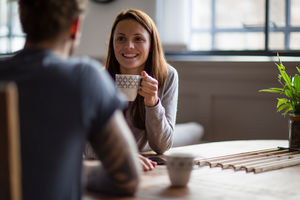 Young adult couple in a cafŽ together