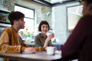 Group of friends having coffee together