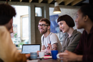 Group of young entrepreneurs listening to a presentation