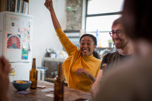Group of friends playing cards together