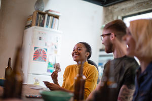 Group of friends playing cards together