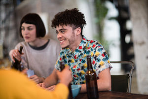 Group of friends playing cards together