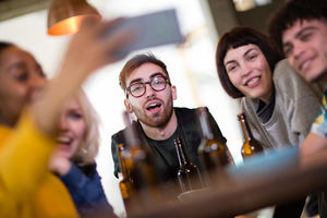 Group of friends posing for a group selfie