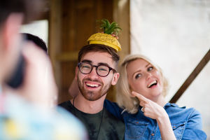 Young adult female mucking around with a friend