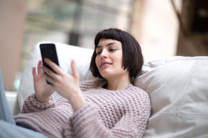 Young adult female on smartphone
