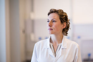 Female medical professional looking thoughtful