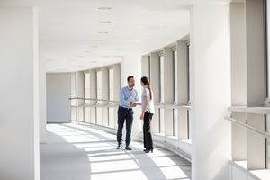 Businesswoman shaking hands with businessman