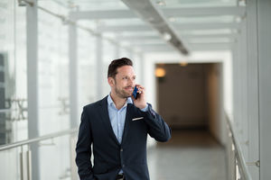 Businessman using smartphone on his commute