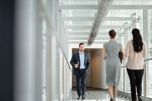 Businessman walking through office corridor