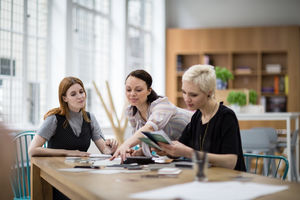 Female coworkers working on a project