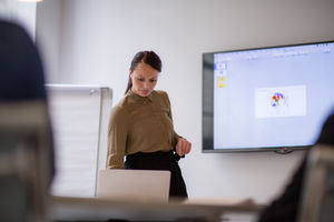 Female business executive setting up a presentation
