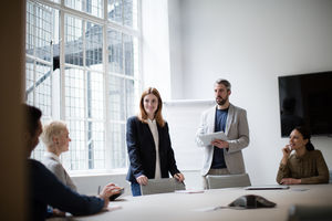 Business executives leading a brainstorm meeting
