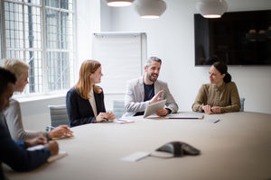 Male business executive leading a meeting
